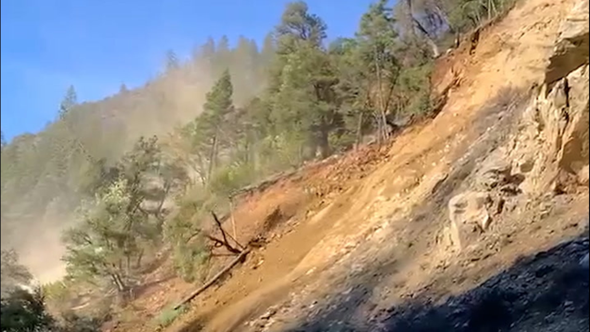 Rocks and trees tumble as landslide covers a California highway