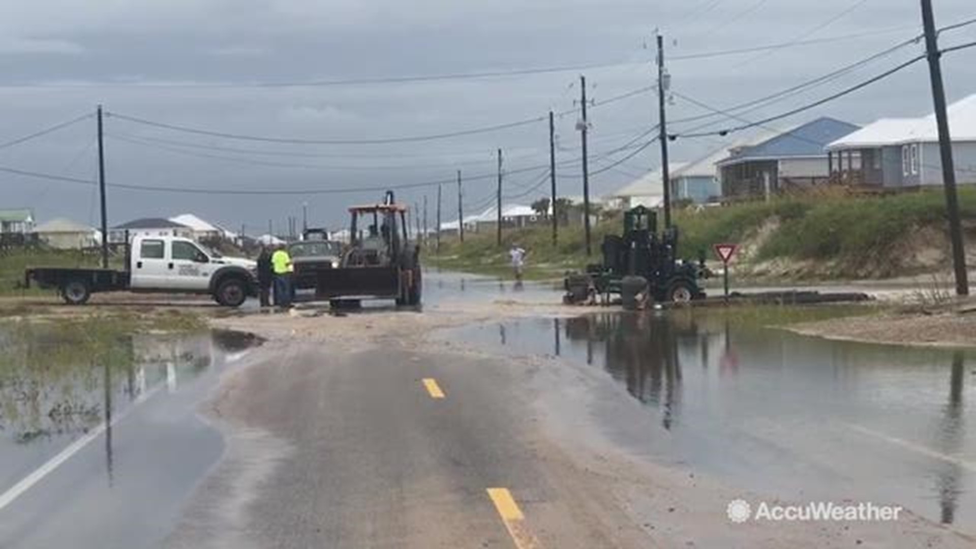 As the area begins to regroup after Tropical Storm Gordon lashed with heavy flooding, sand that spread inland begins to get cleared out on Sept. 5.