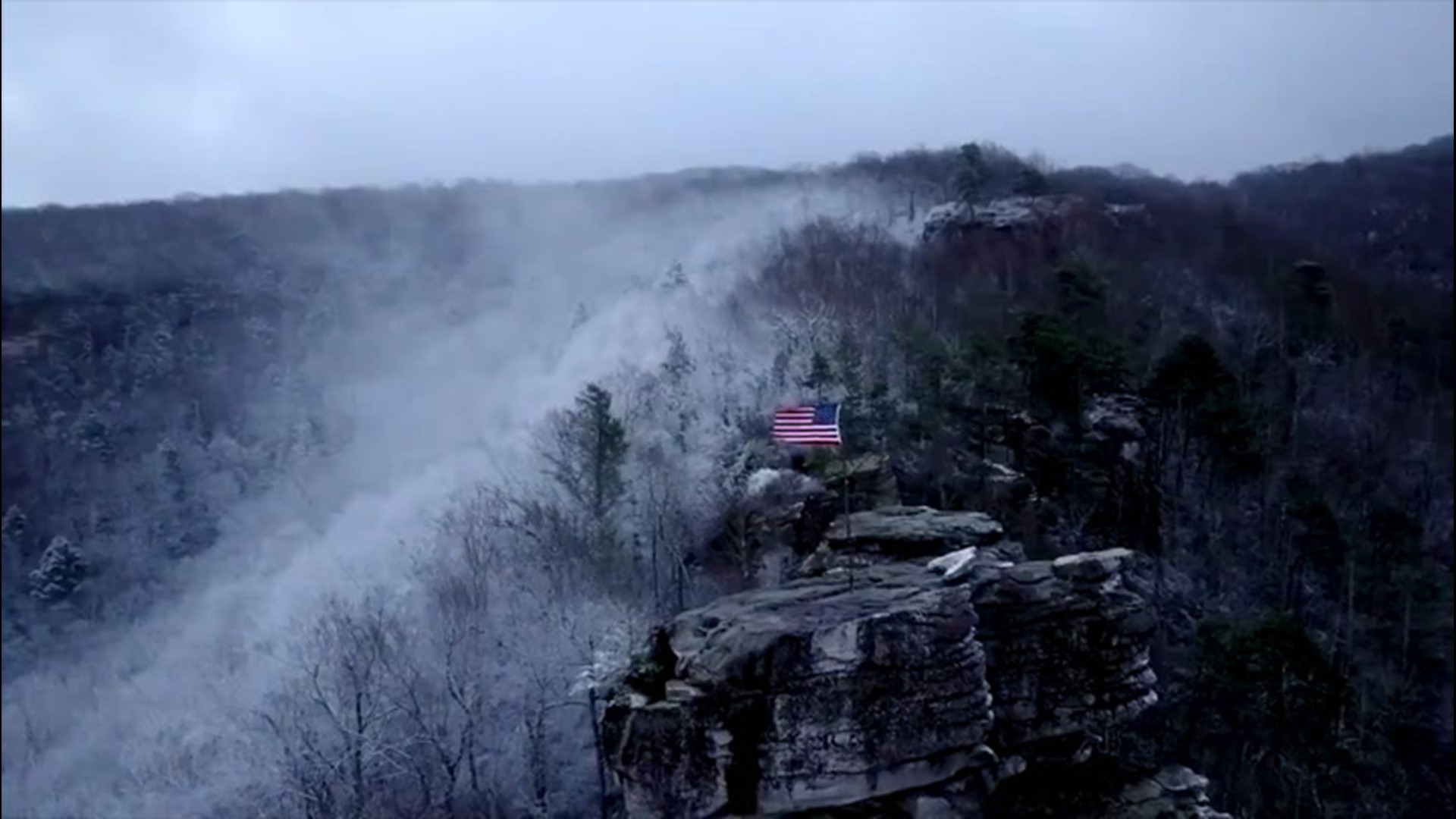 An American flag can be seen blowing in the wind atop Flag Rock in Norton, Virginia, on Nov. 30.
