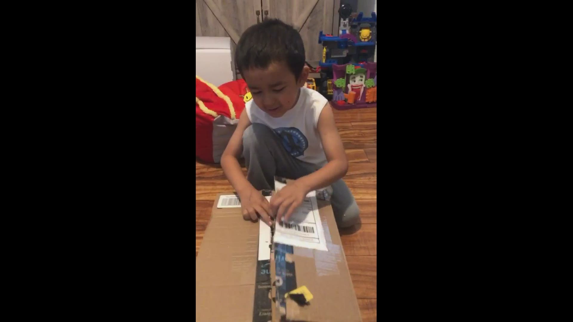 This little boy excitedly opens his smile box from North Carolina teen Hetti Price-Bailey.