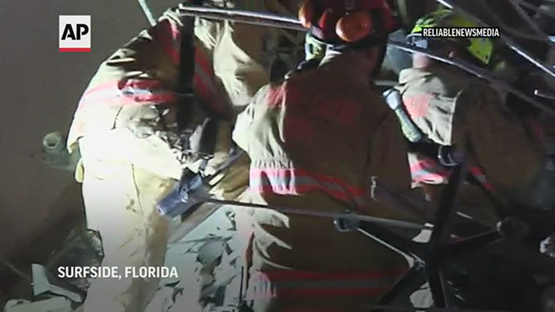 Video showed fire crews removing a boy from the wreckage of a Miami-area condo collapse on June 24, 2021.