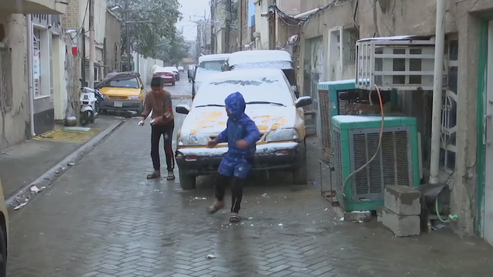 Snow fell across the Iraqi capital Baghdad for the first time in a decade on Tuesday, as morning temperatures uncharacteristically hovered around freezing.