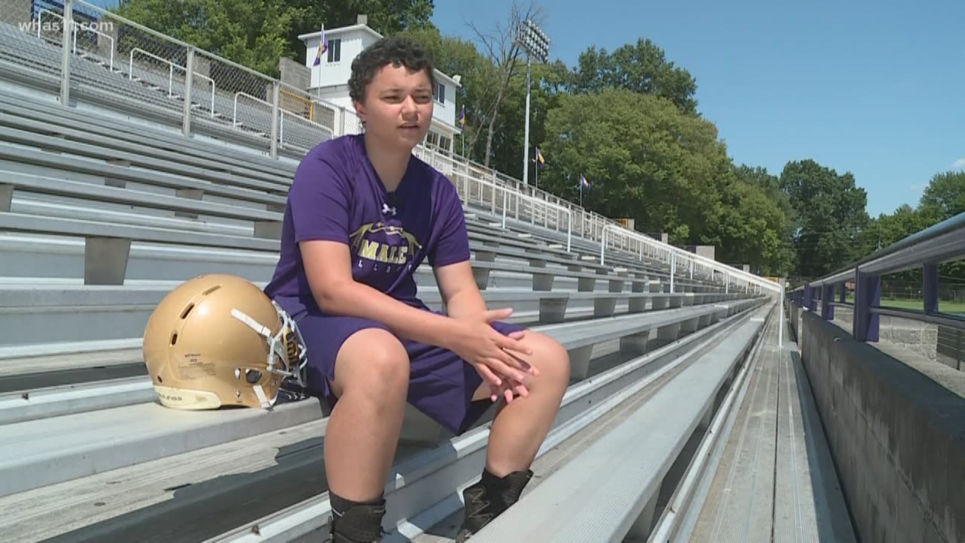 Male High School Football Player beats cancer, returns to field