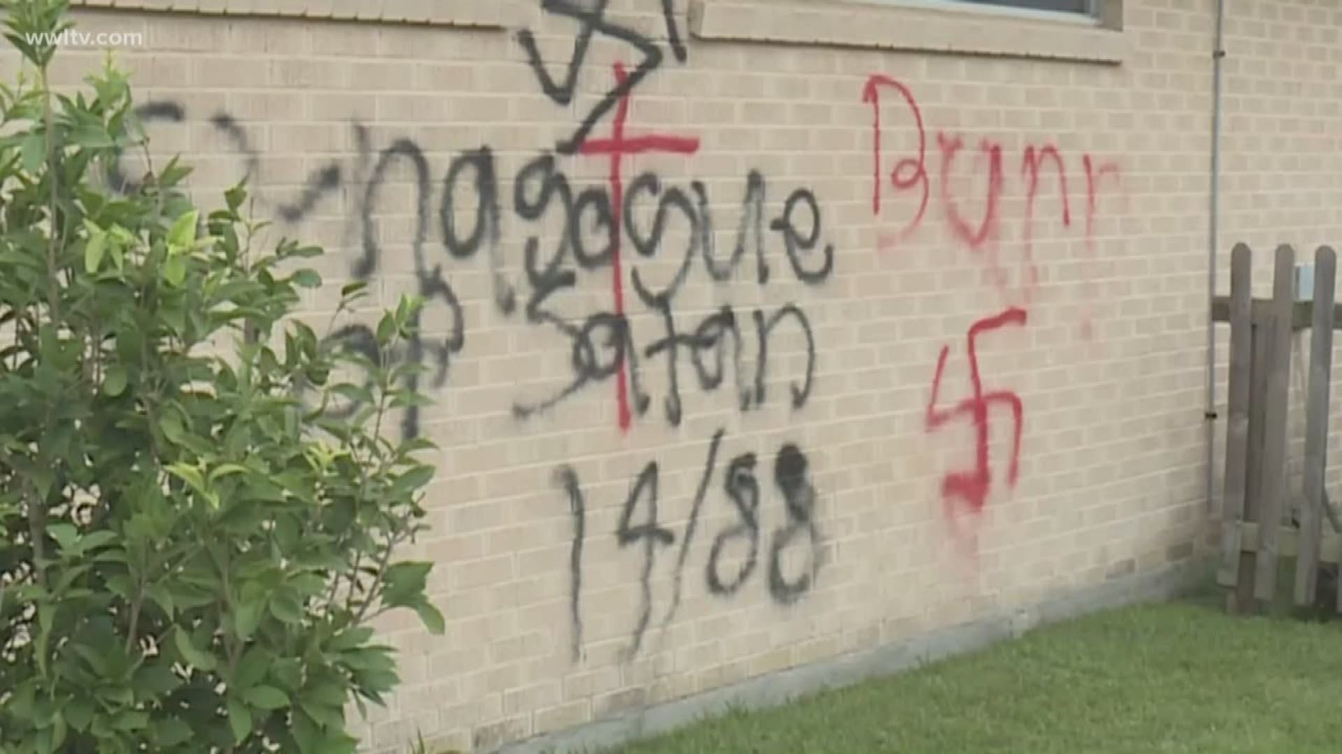 A photo of the graffiti showed swastika symbols in red and black, and the words "synagogue of Satan 14/88" appear as well.