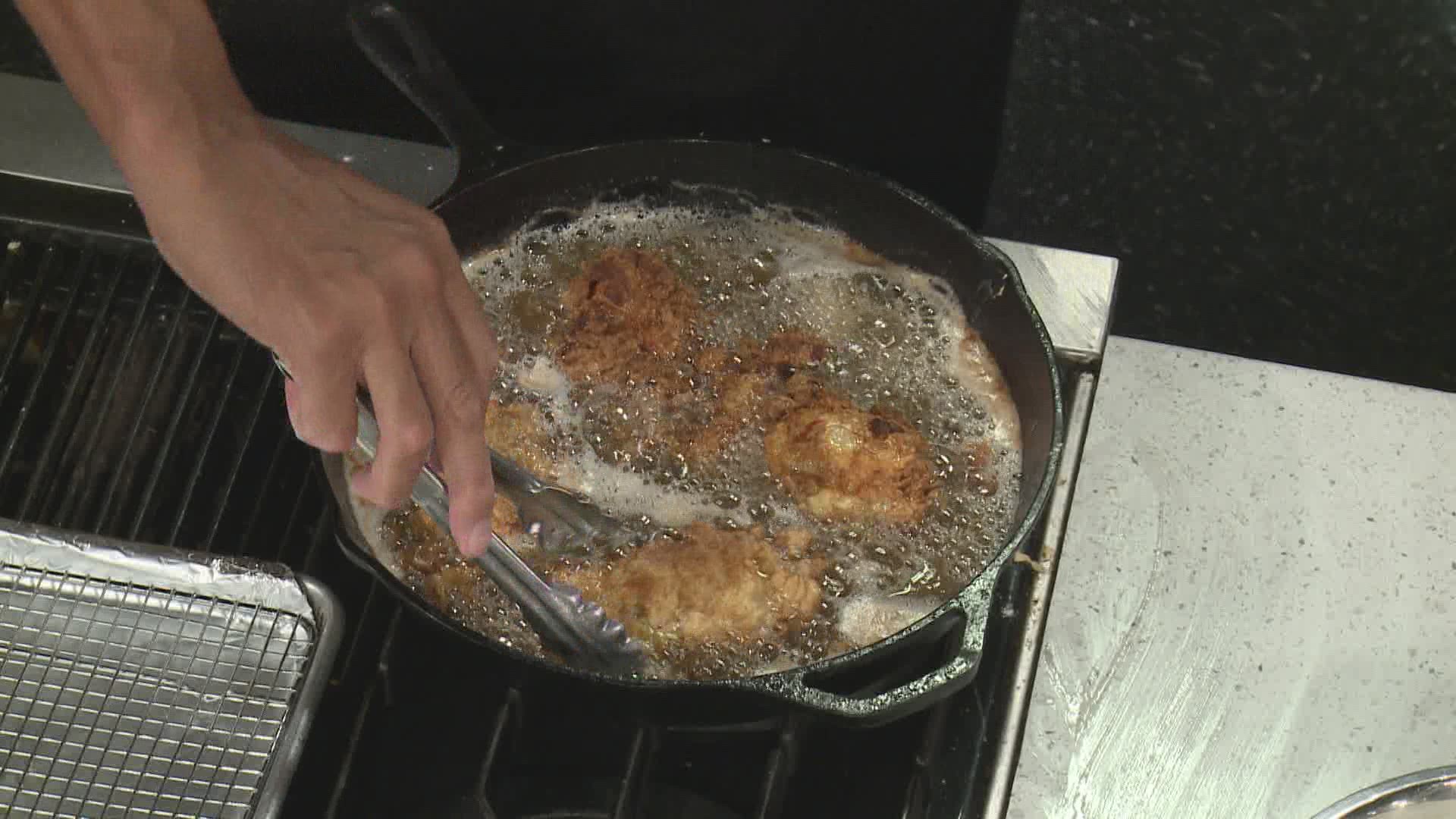 Chef Kevin Belton fries chicken and tops them with a sweet and savory sauce.