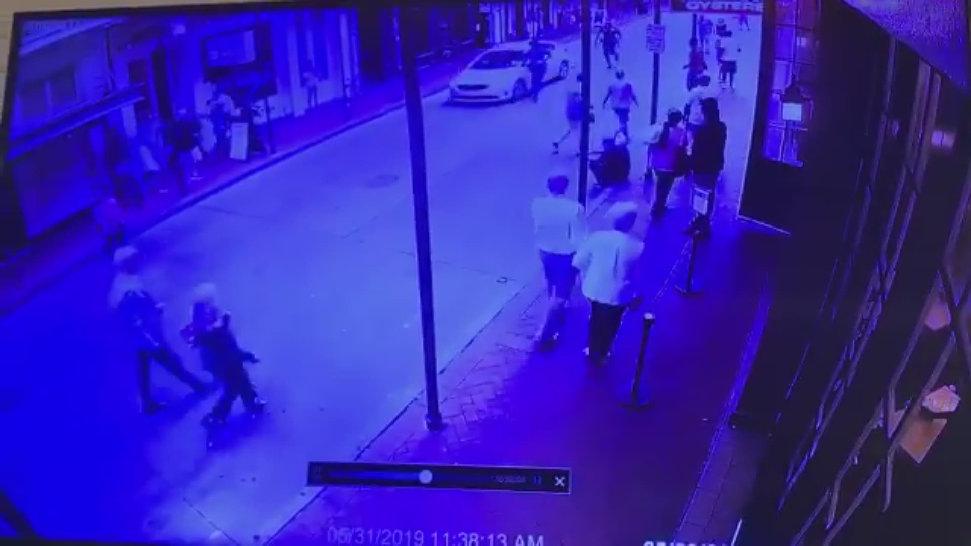 A surveillance video from Bourbon Street shows a driver going the wrong way down the street with a couple of what appear to be State Troopers following, trying to get him to stop.
