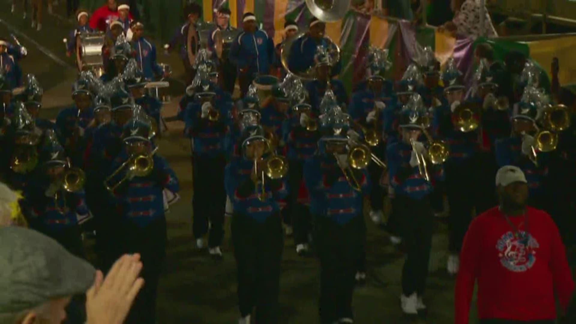 John Ehret High School students danced, played music and marched along St. Charles Avenue Wednesday night.