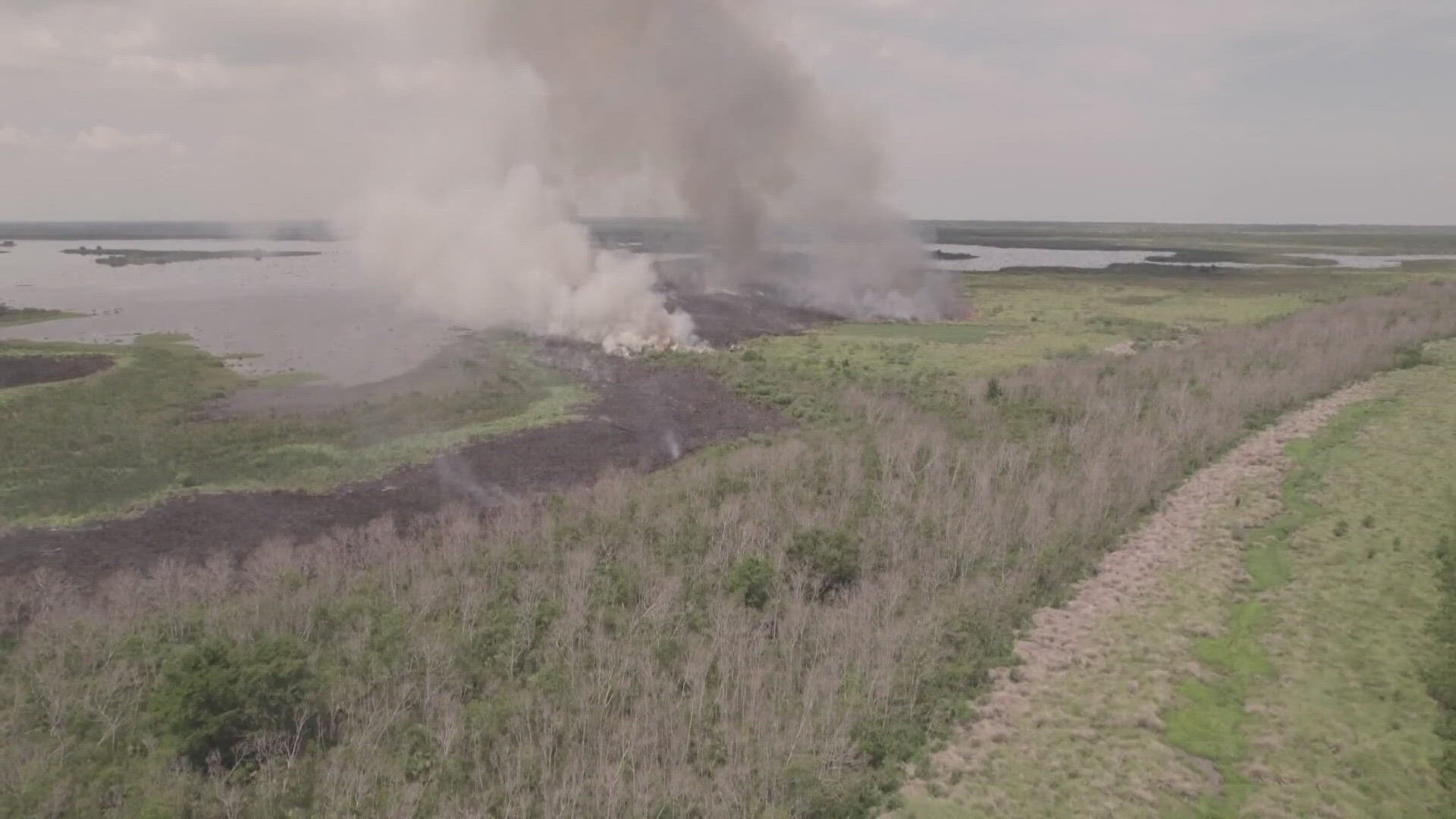 The fire has now burned at least 500 acres of marshland.