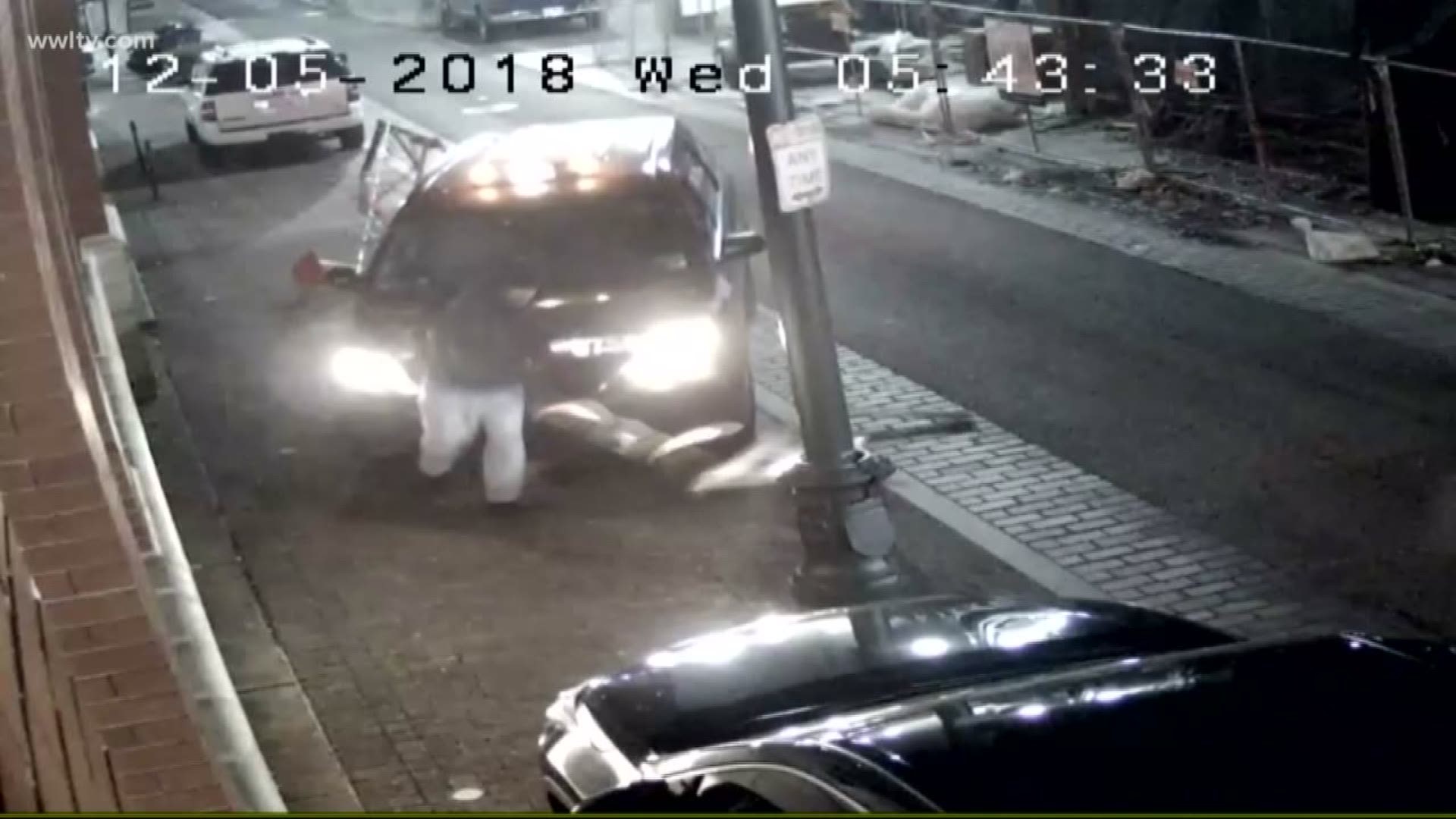 Surveillance video appears to show a cab drive onto the sidewalk and into an alleged cell phone thief.