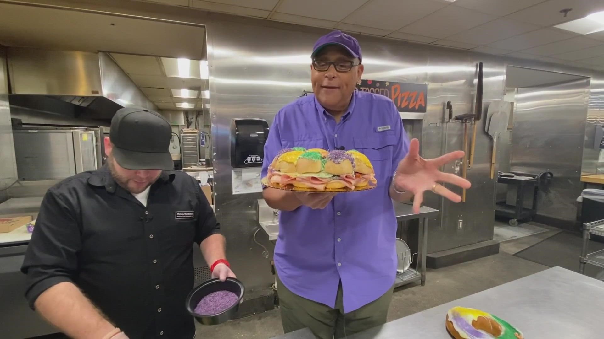 Chef Kevin Belton is in the Rouses Supermarket kitchen checking out their King Cake Muffuletta.