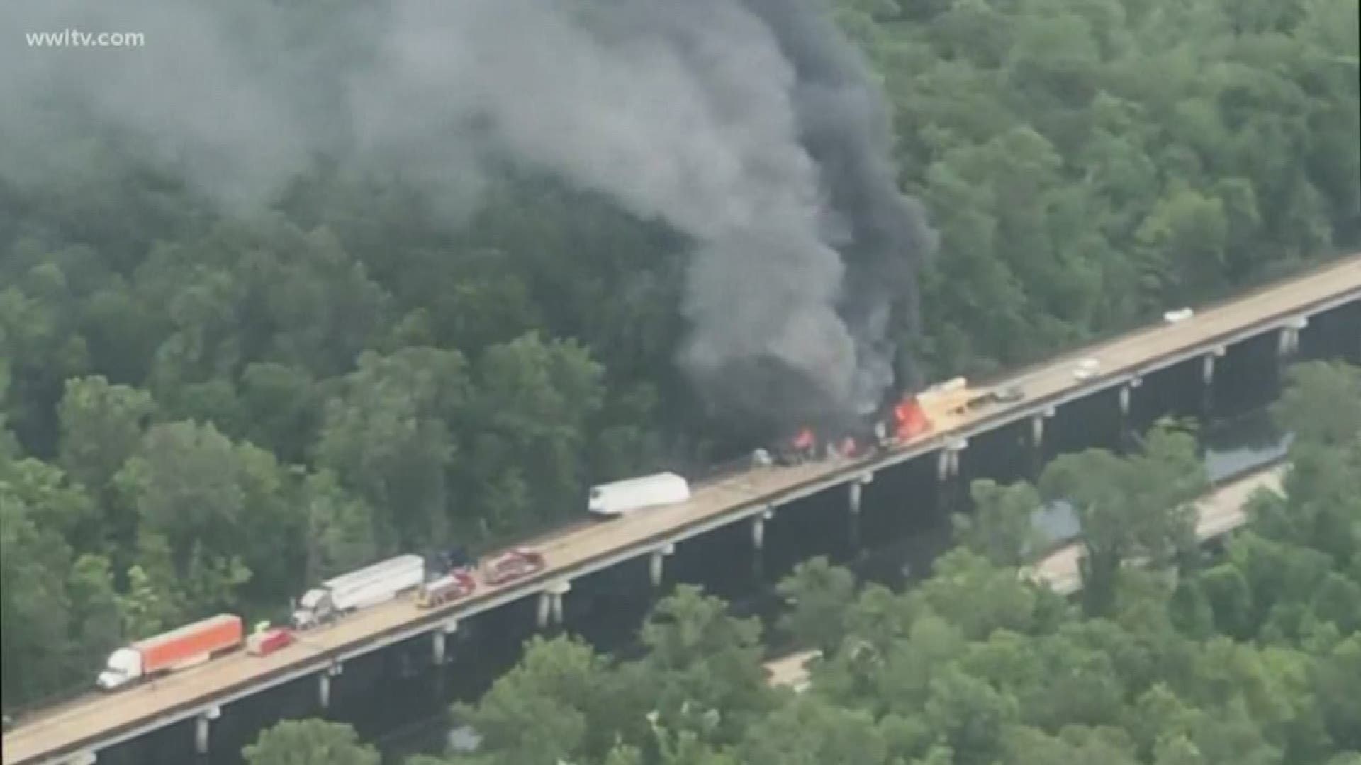 Police found the burned remains of one person after extinguishing a massive fire that spread through multiple semi-trucks on I-10 Westbound on the Basin Bridge.