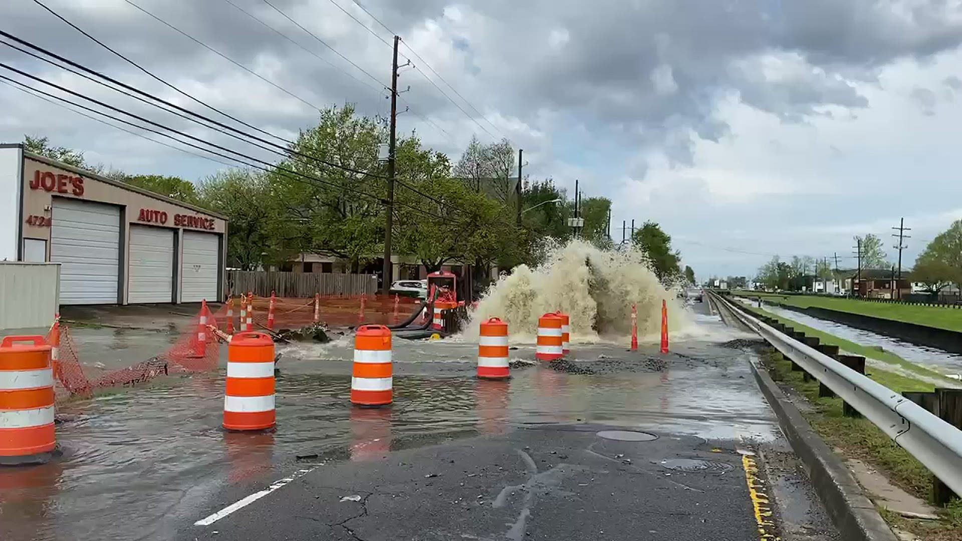 The video shows water shooting into the air and flooding the street around several businesses in Metairie on West Napoleon.  Video: Billy Brakel