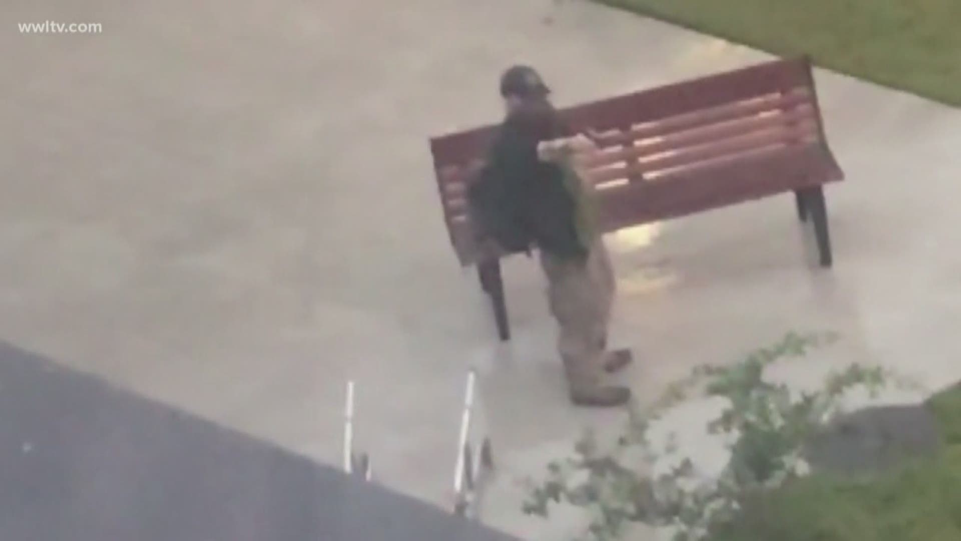 Video shows the man pull out a handgun and open fire in an apartment complex's courtyard.