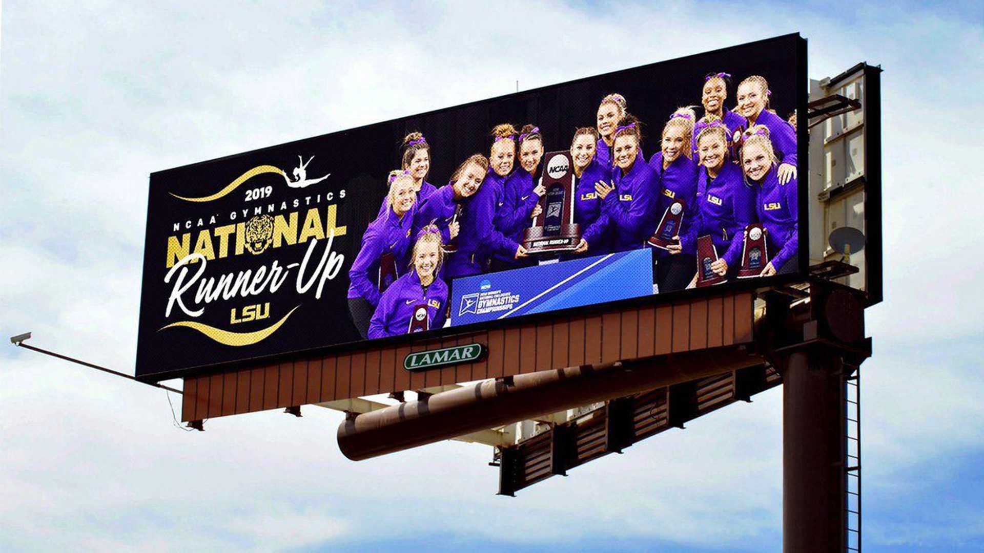 LSU's gymnastics team finished second nationally at the NCAA Championships Saturday night, and the school thanked them for the fine season with an electronic billboard message that sent one national sports writer into a tizzy.
