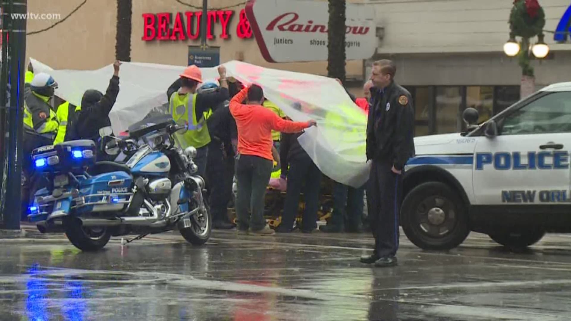 According to an eyewitness, several motorcycle officers seemed to be escorting some buses along the street when the injured officer tried to stop his bike and was hopping on his leg trying to make the stop when the motorcycle fell on his leg.