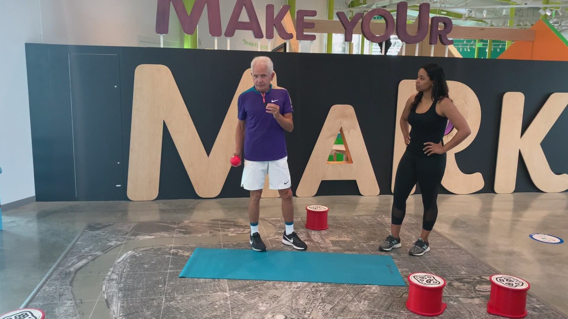 Fitness expert Mackie Shilstone shows April Dupre some ways to improve hip stability and tighten the hamstring.