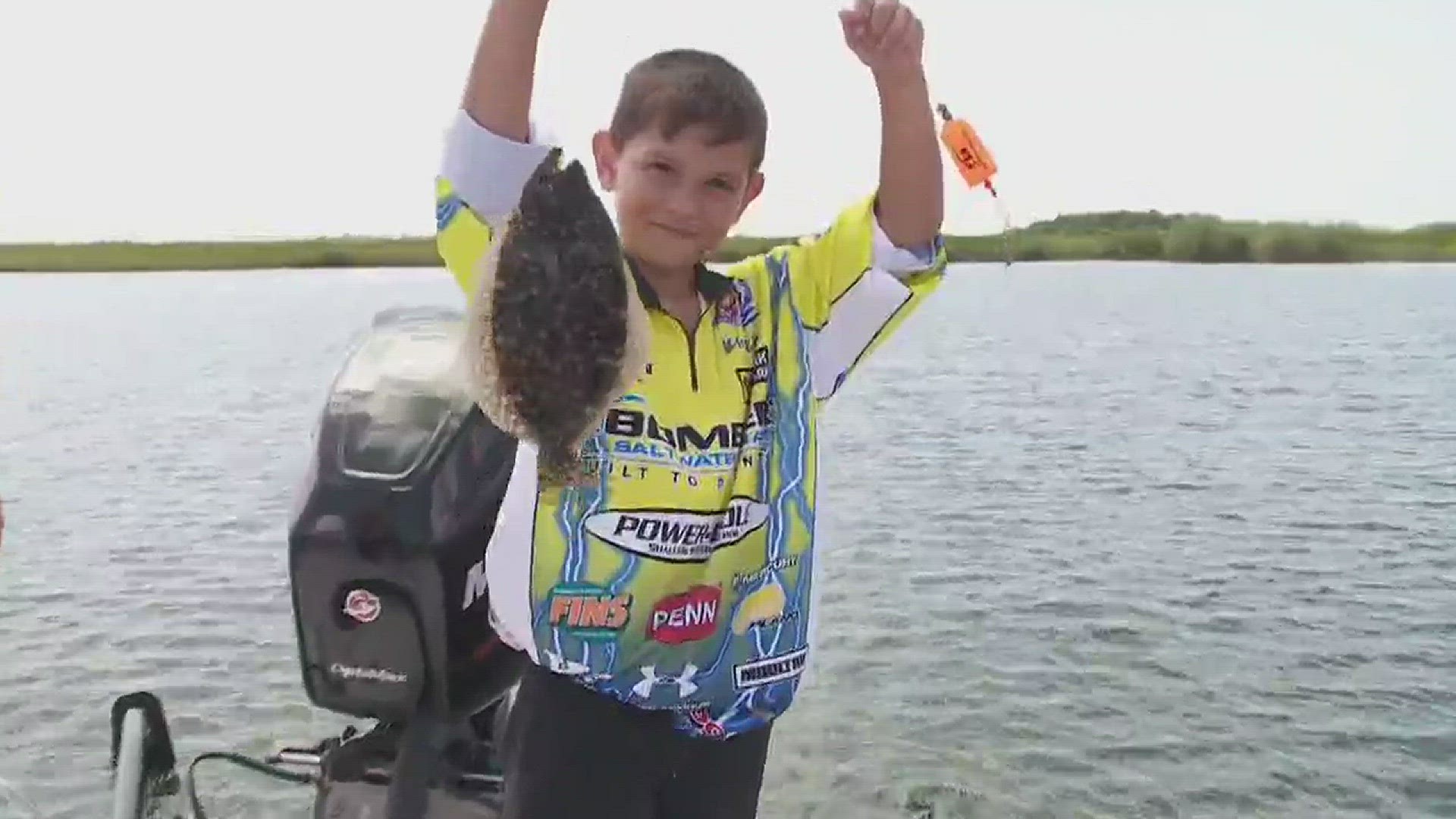 Don Dubuc talks to young fishermen about sporting and going back to school.
