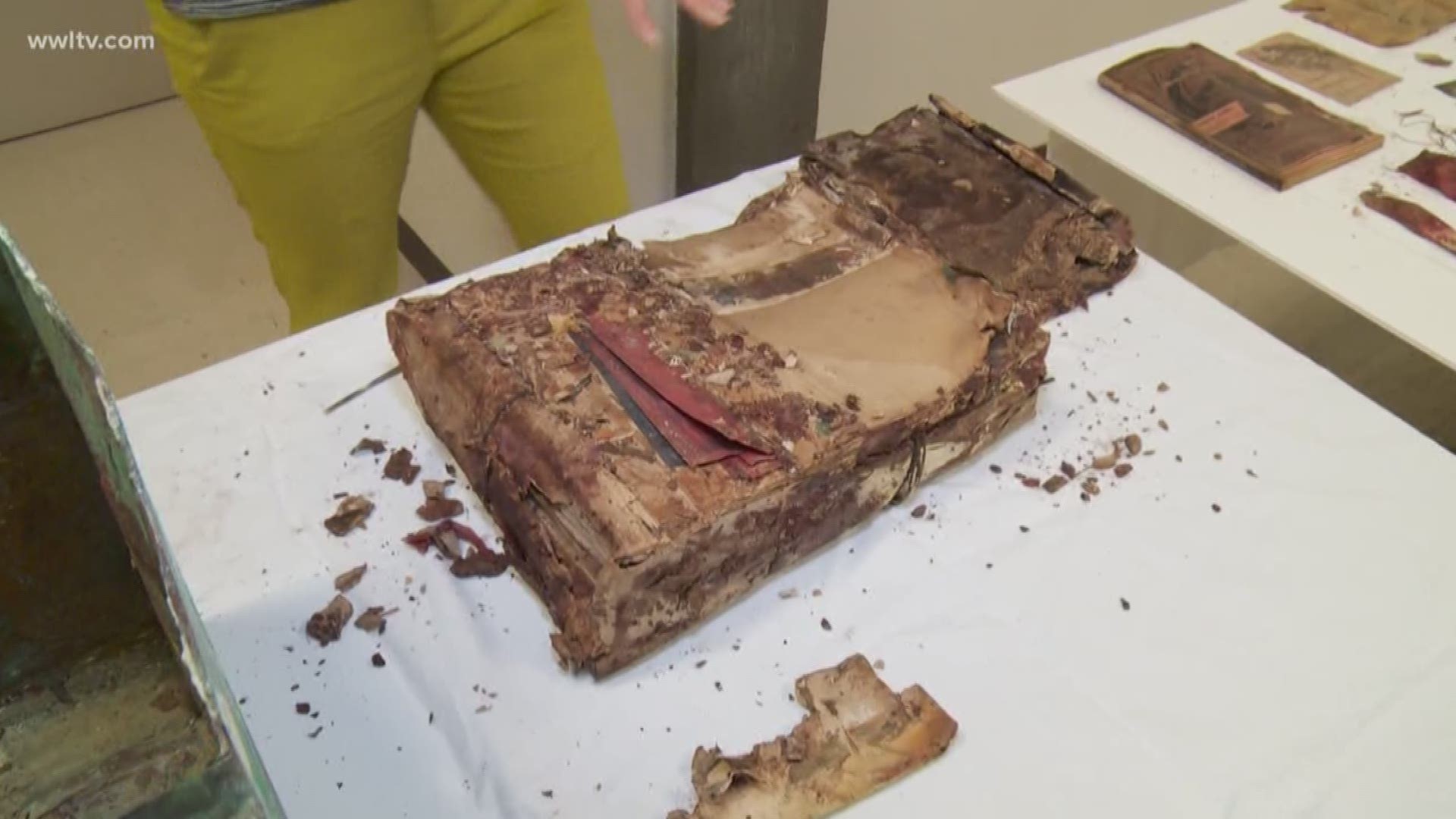 Curators with the Louisiana State Museum gave the media a closer look at a time capsule's contents.