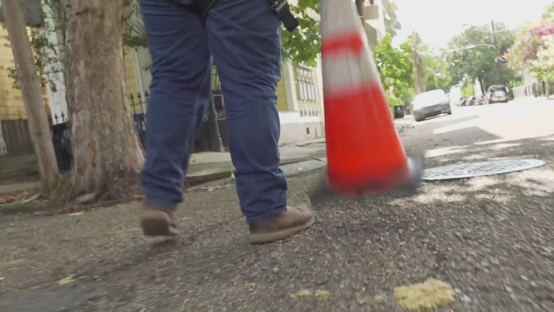 Entergy workers walked the Garden District looking for problems. They are called "walkdowns."