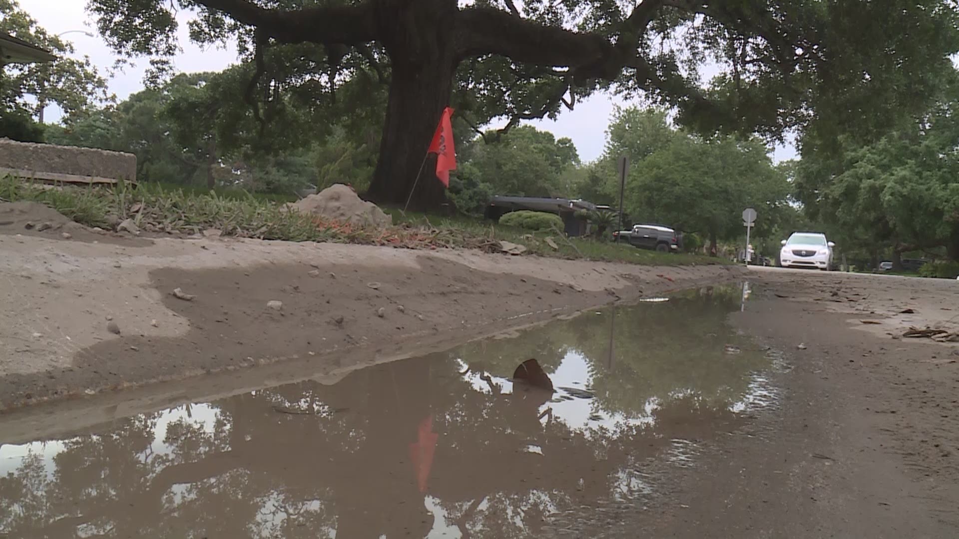 People living in New Orleans’ Lake Terrace neighborhood are scratching their heads, curious about what caused several large holes to form and gush water over the weekend.