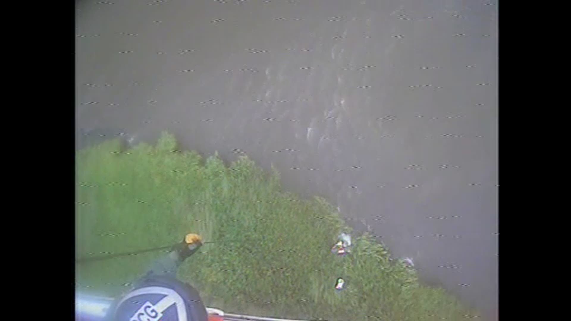 A Coast Guard Air Station New Orleans MH-65 Dolphin Helicopter aircrew rescues a man following a seaplane crash in Chandeleur Sound, approximately 25 miles west of the Chandeleur Islands, Louisiana, August 18, 2019.