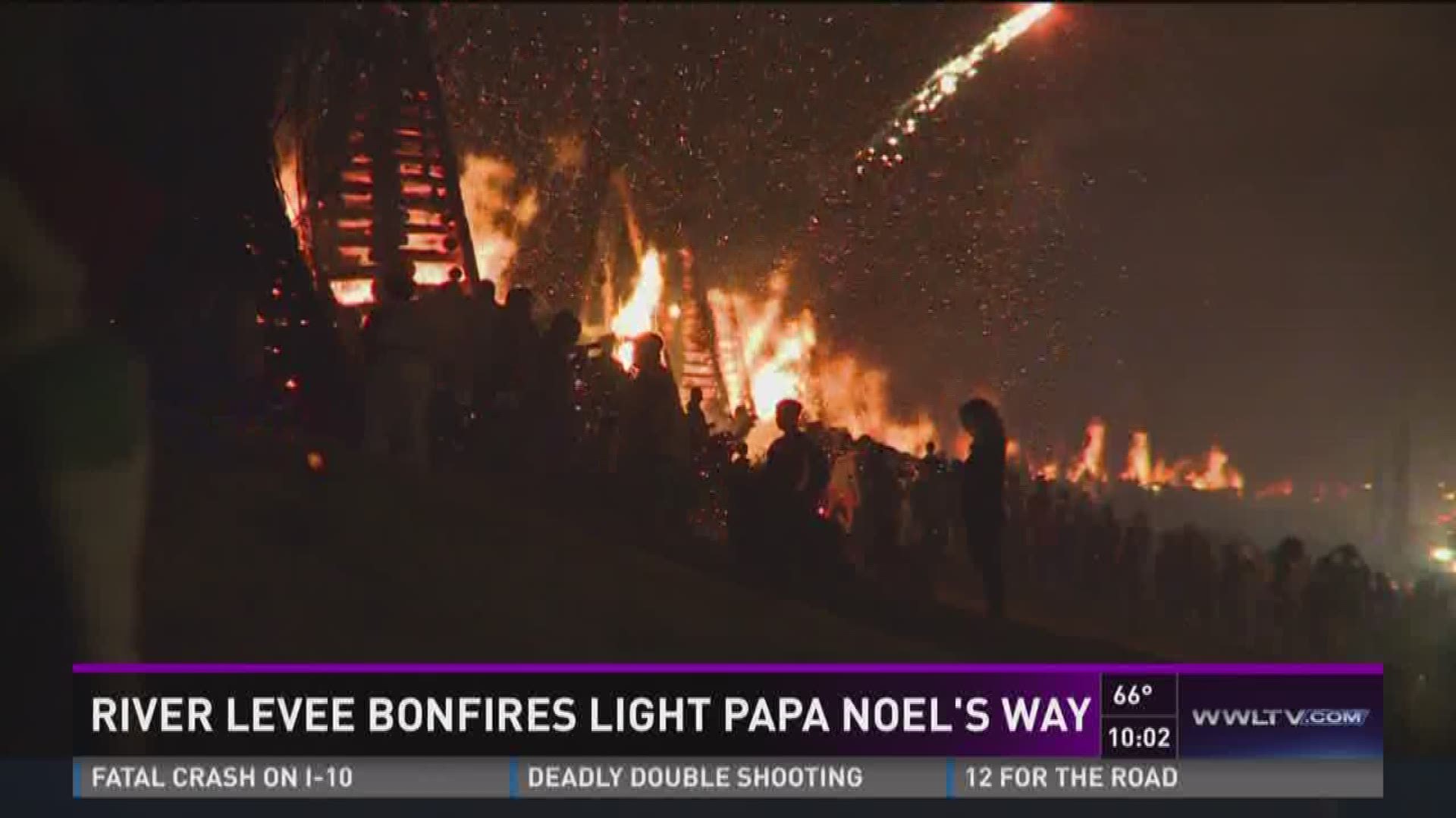 River levee bonfires light Papa Noel's way