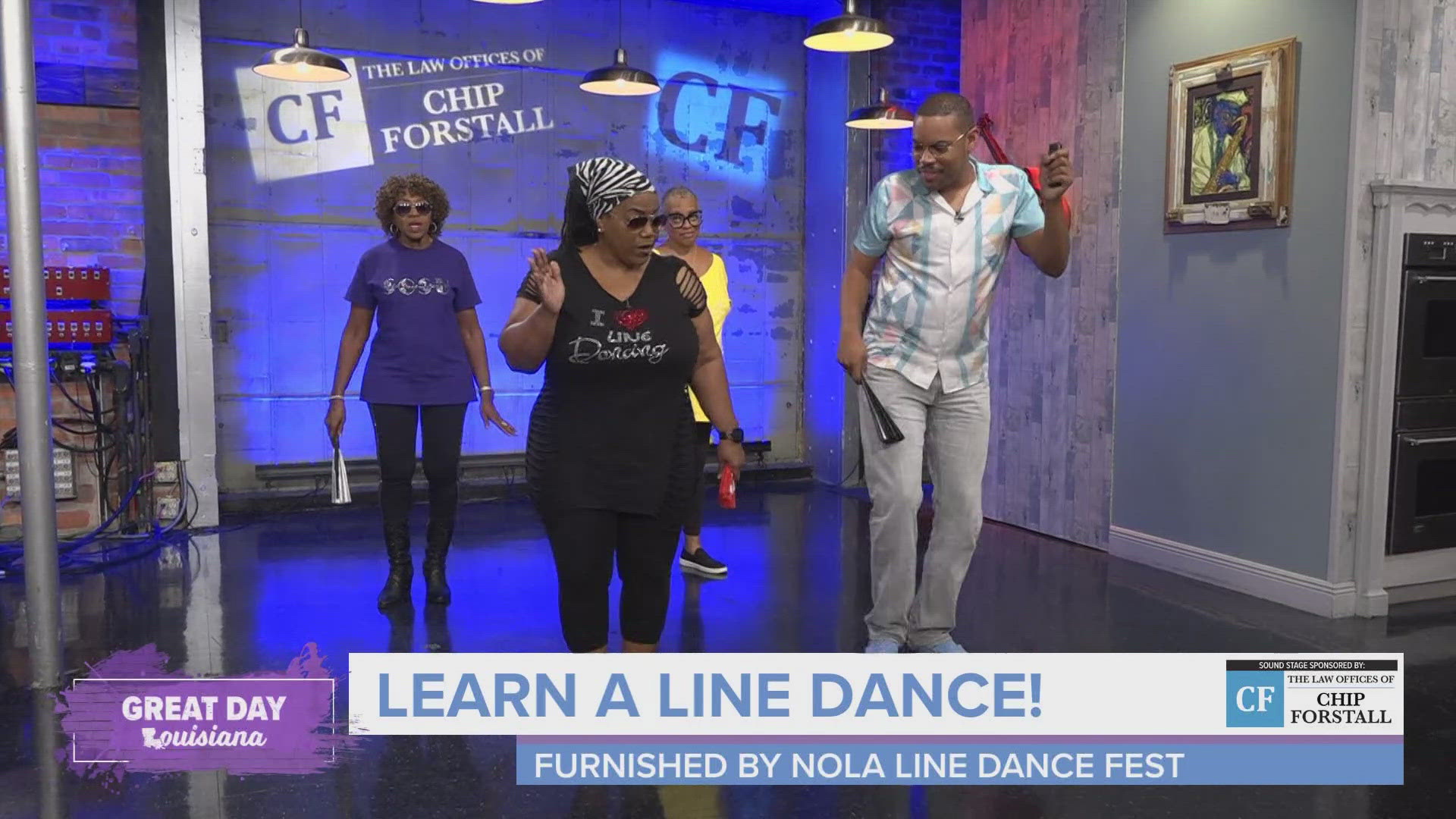 Lady D, a local line dance teacher, shows Malik the steps to the line dance for "Boots On The Ground."