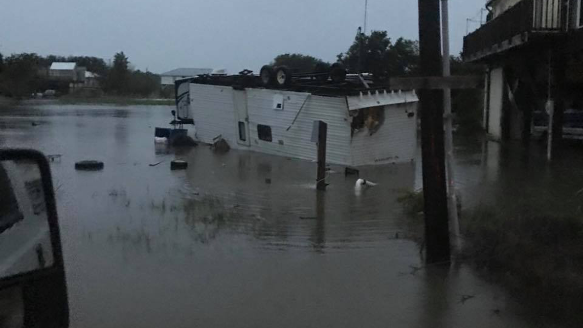 Photos show collapsed warehouse, flooding in Grand Isle