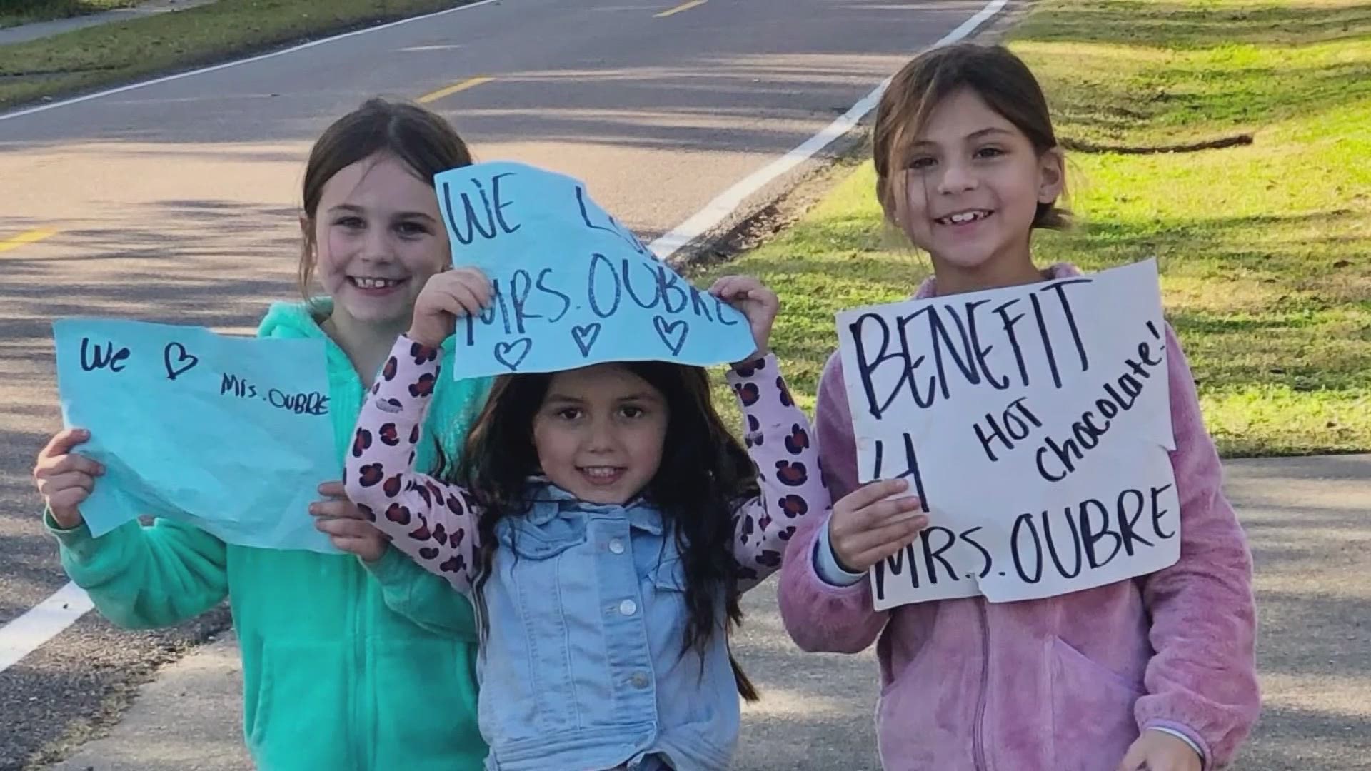 Three girls from Norco, Louisiana were out selling hot chocolate last weekend to help raise money for their beloved kindergarten teacher whose cancer has returned.
