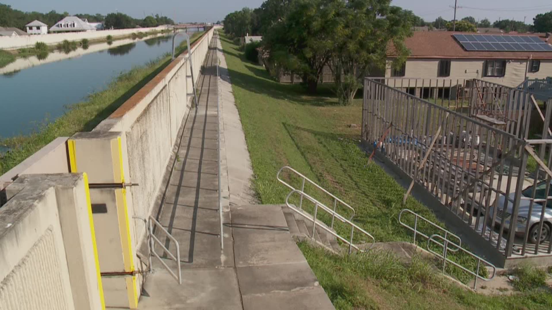 David Hammer talks to homeowners with property near the London Avenue canal.