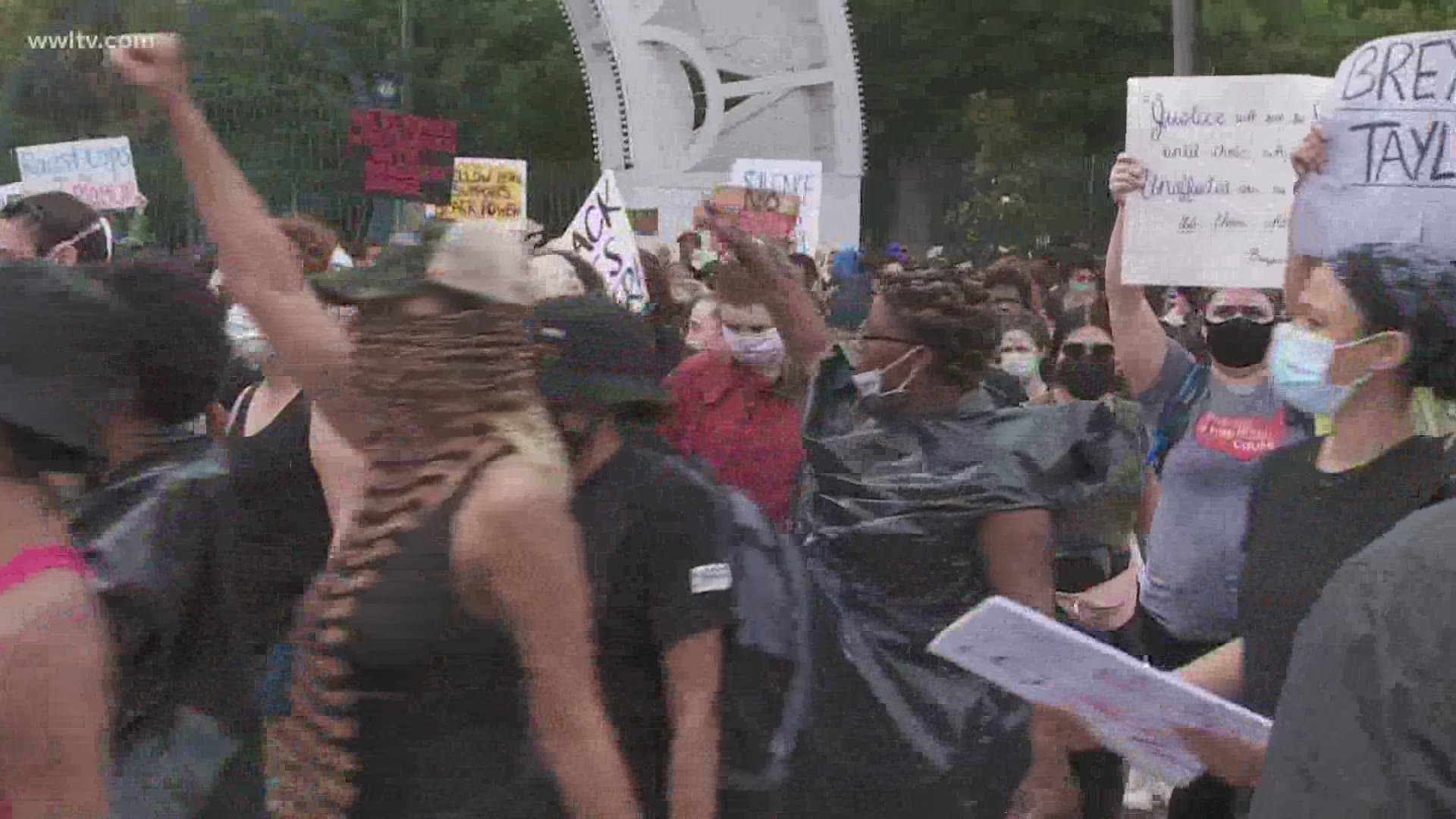 Protesters marched from City Park to the Hard Rock Hotel collapse site despite the rain and the coronavirus pandemic.
