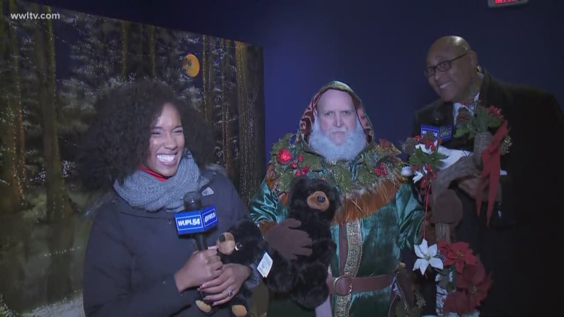 Sheba and Kevin meet the man of the hour, Santa Claus, who will appear nightly at Audubon Zoo Lights,.