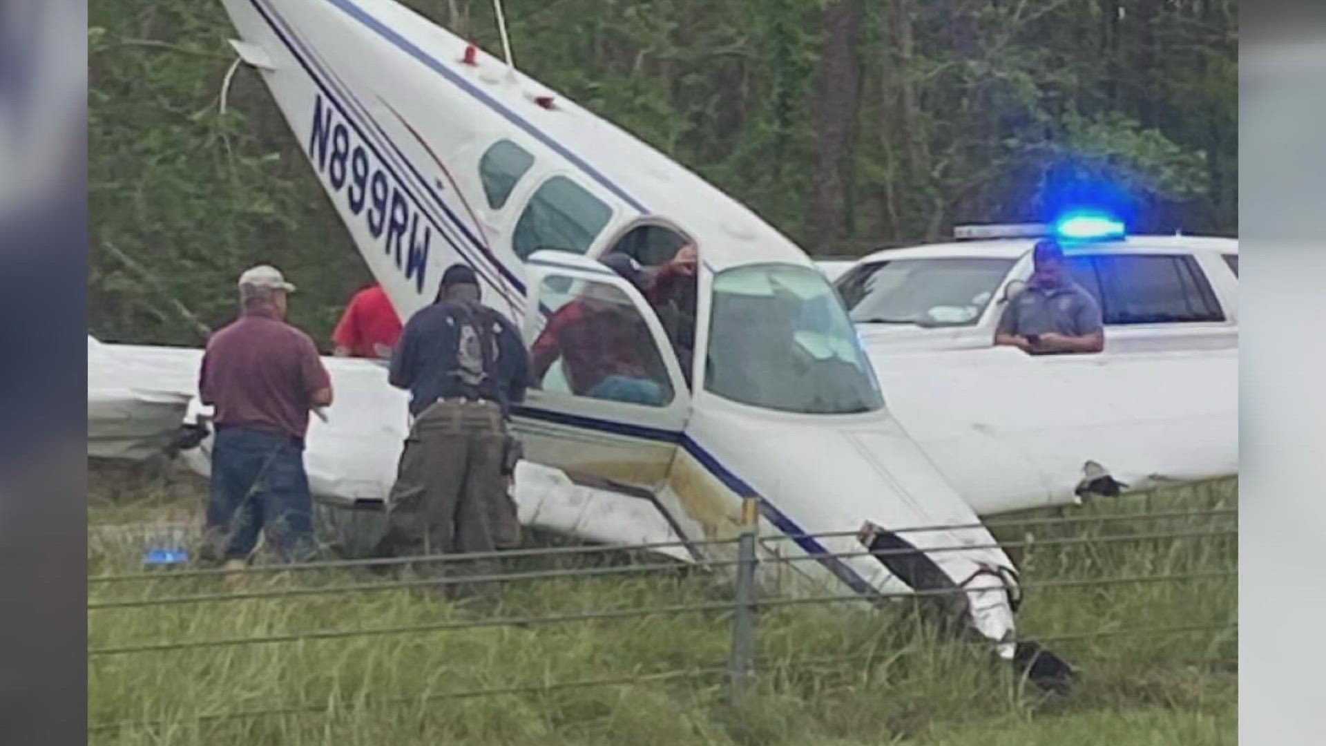 Small plane crashes into car during emergency landing in North