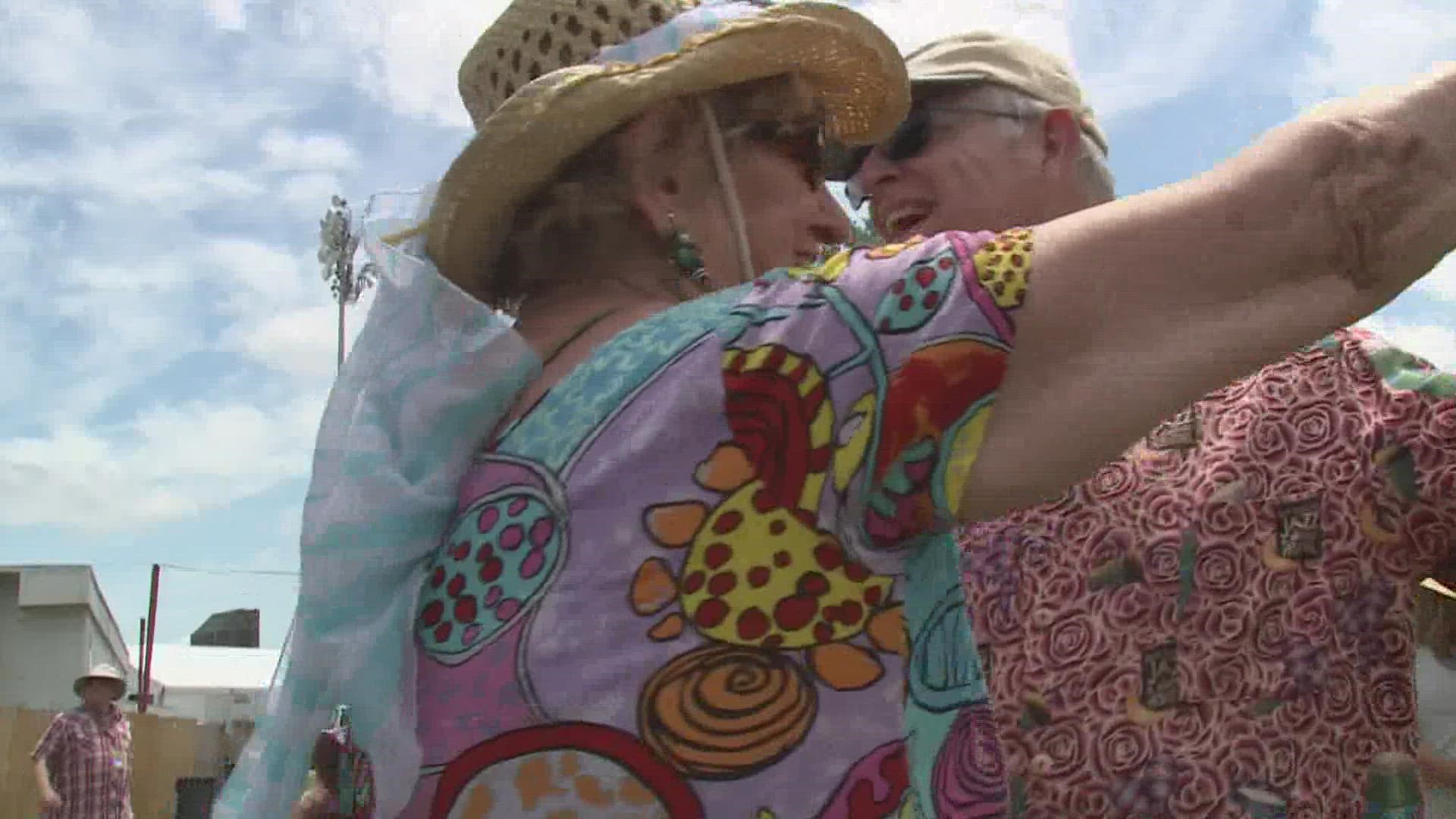 People burst through the gates of the fair grounds Friday afternoon to return to the festival.
