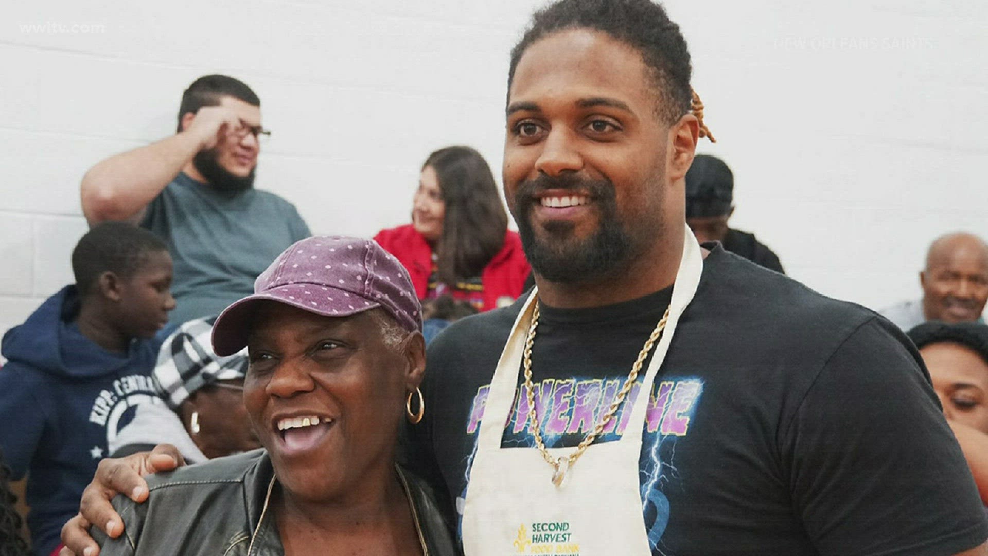 DE Cameron Jordan and WR Michael Thomas helped 300 families at the event.