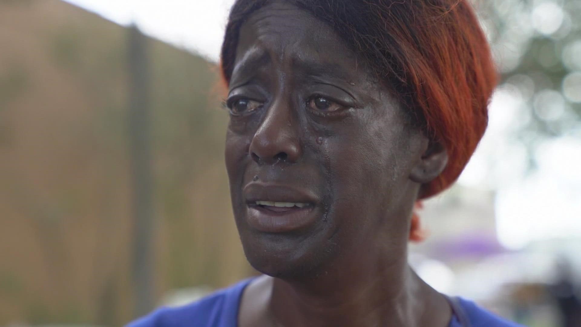 A New Orleans woman waited hours in line for free food after Hurricane Ida forced the roof over her head to cave in.