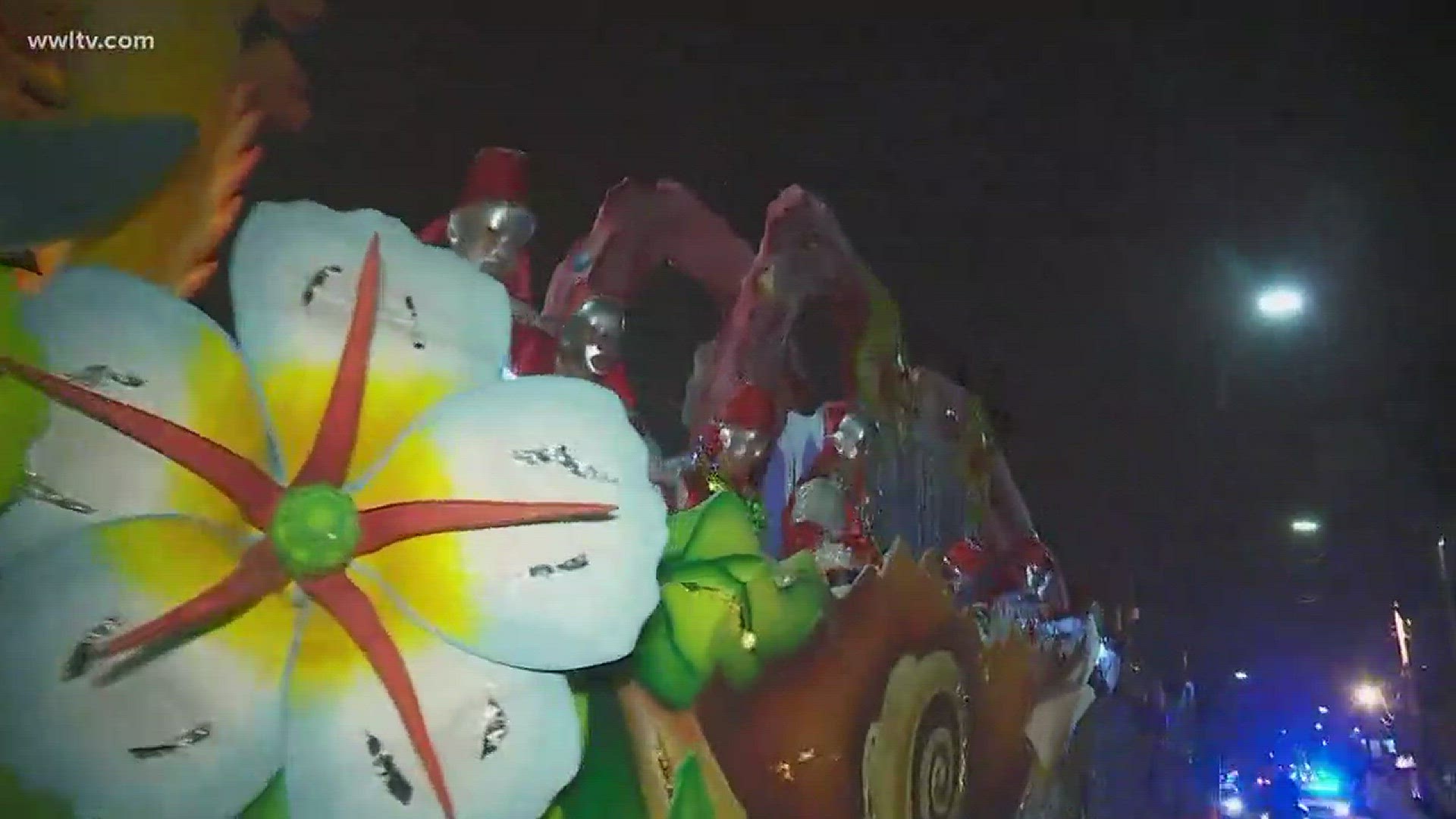 Blinking lights, biting satire and burning flambeaux were on display in New Orleans Friday.
