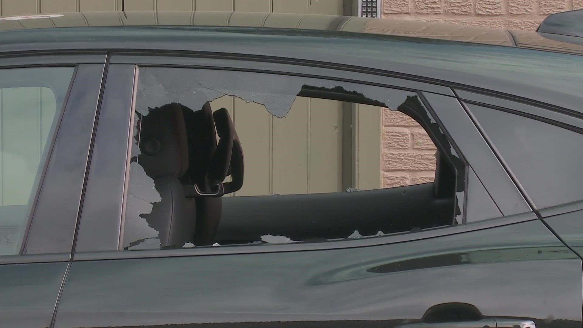 The woman said she heard shots and that the glass in her rear window was shot out.