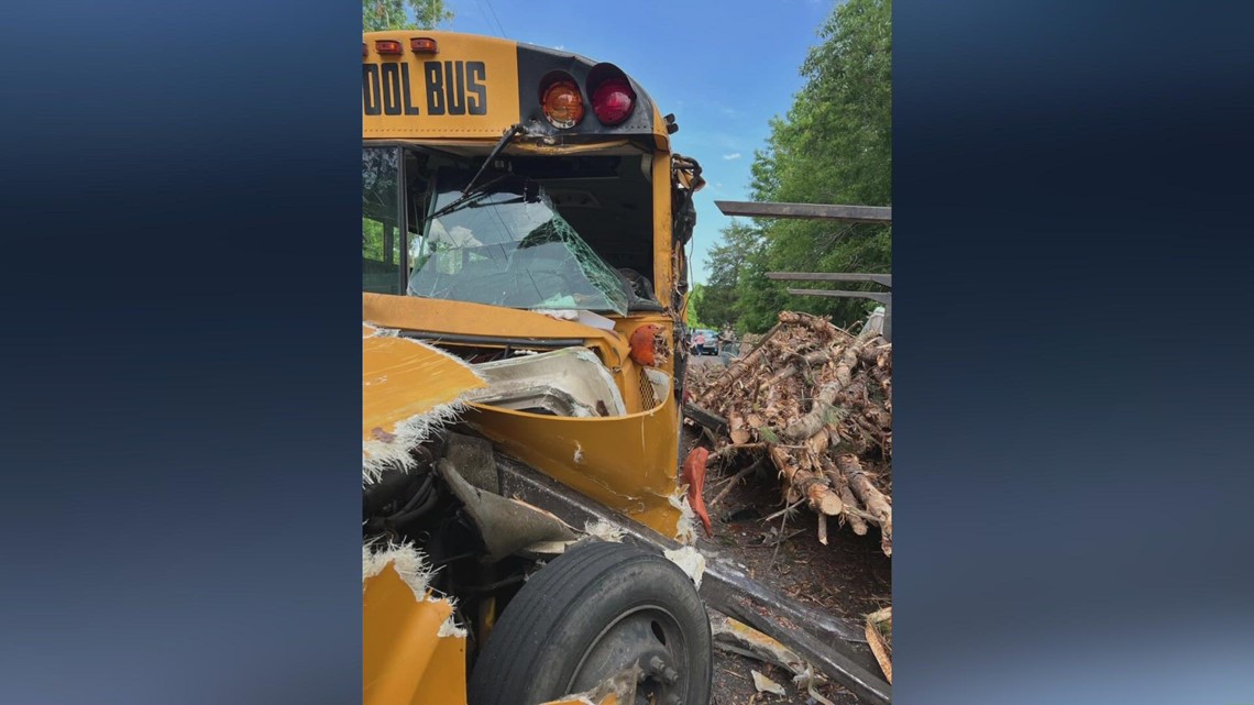 Log truck crashes into school bus