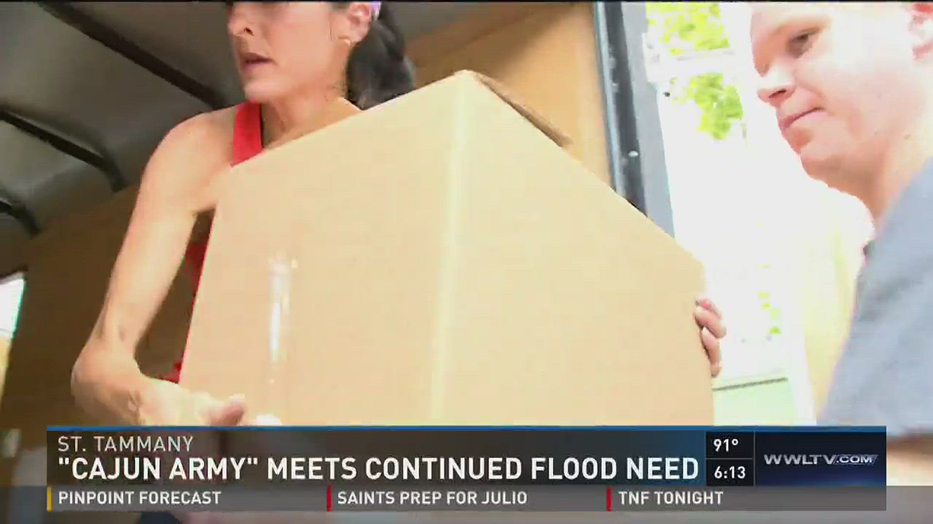 Ashley Rodrigue talks to those in the 'Cajun Army', who are helping people with supplies after historic flooding.