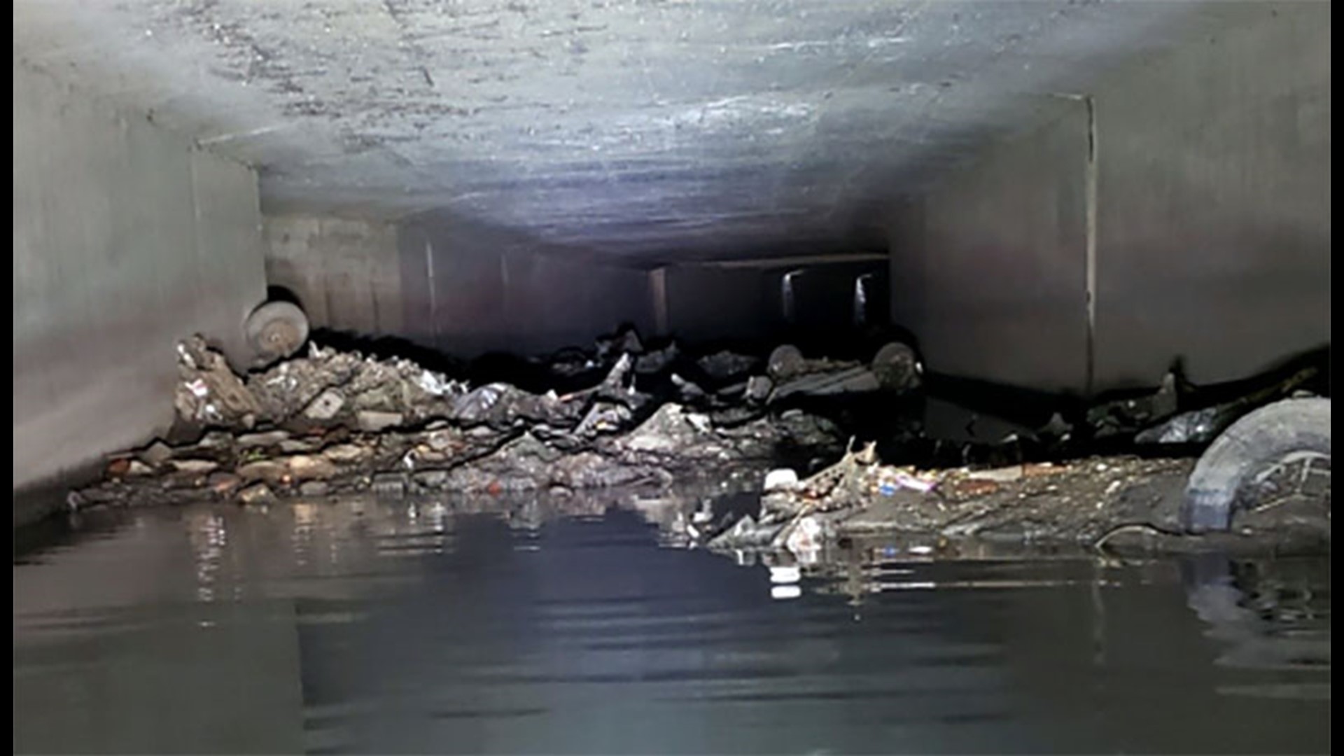 hAn inspection of an underground canal that overtopped during a July 10 flooding event showed an overturned car and other debris blocking the flow of water, according to the New Orleans Sewerage & Water Board.