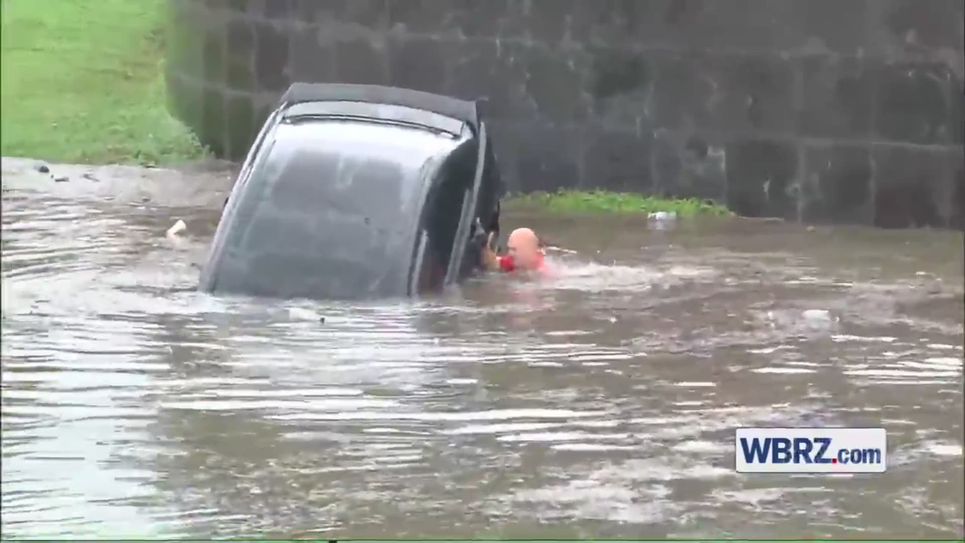 WBRZ video shows firefighters rescuing woman from flooded car
