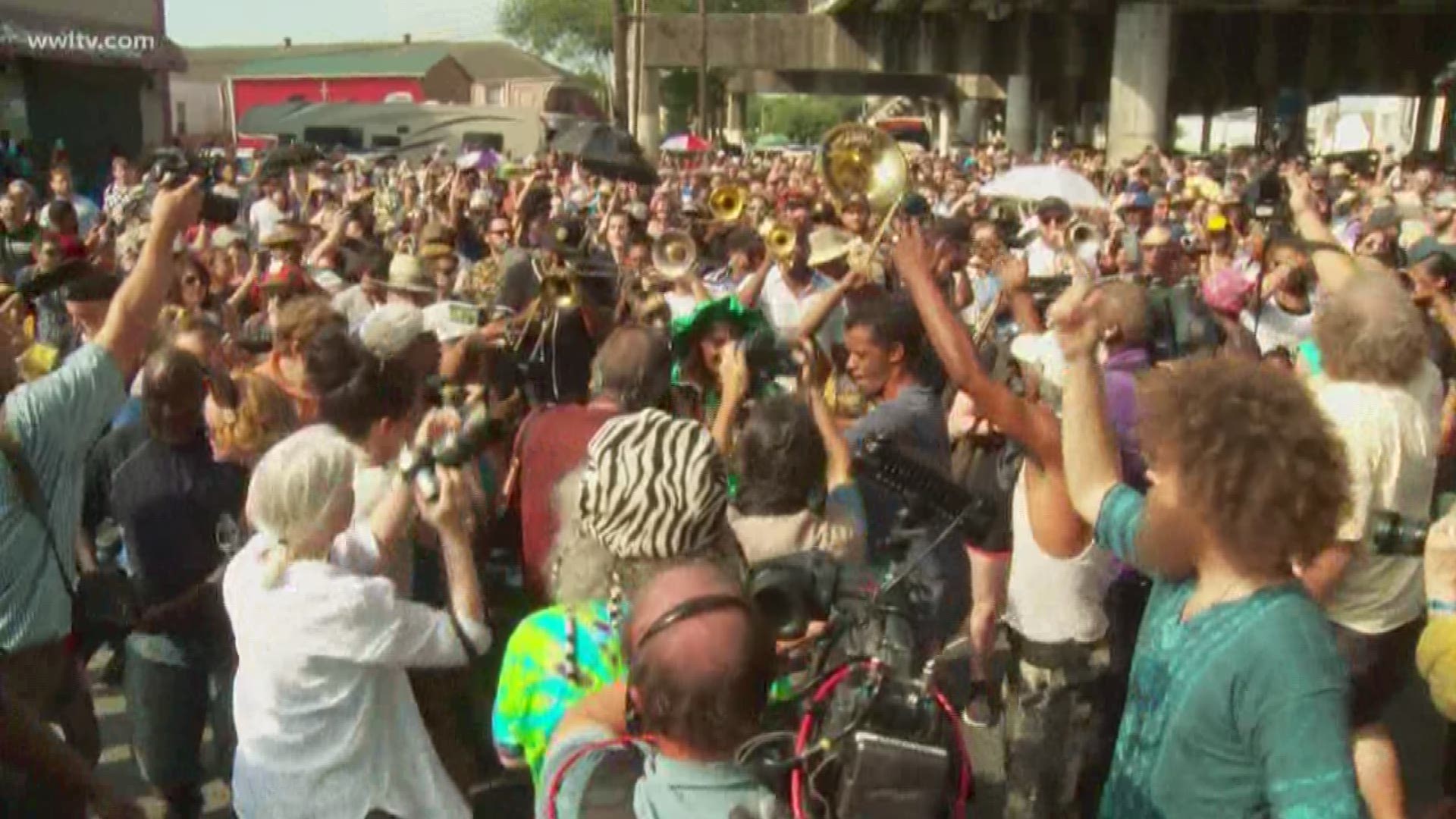 In the heart of Treme, with the temperature feeling close to 100 degrees, the trumpets played, the people danced and thousands marched in the streets -- honoring the life of New Orleans musician and icon Dr. John.