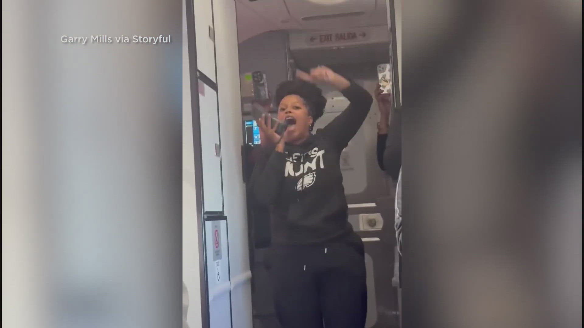 Fly, Eagles Fly! Philadelphia fans sing the team fight song on a flight