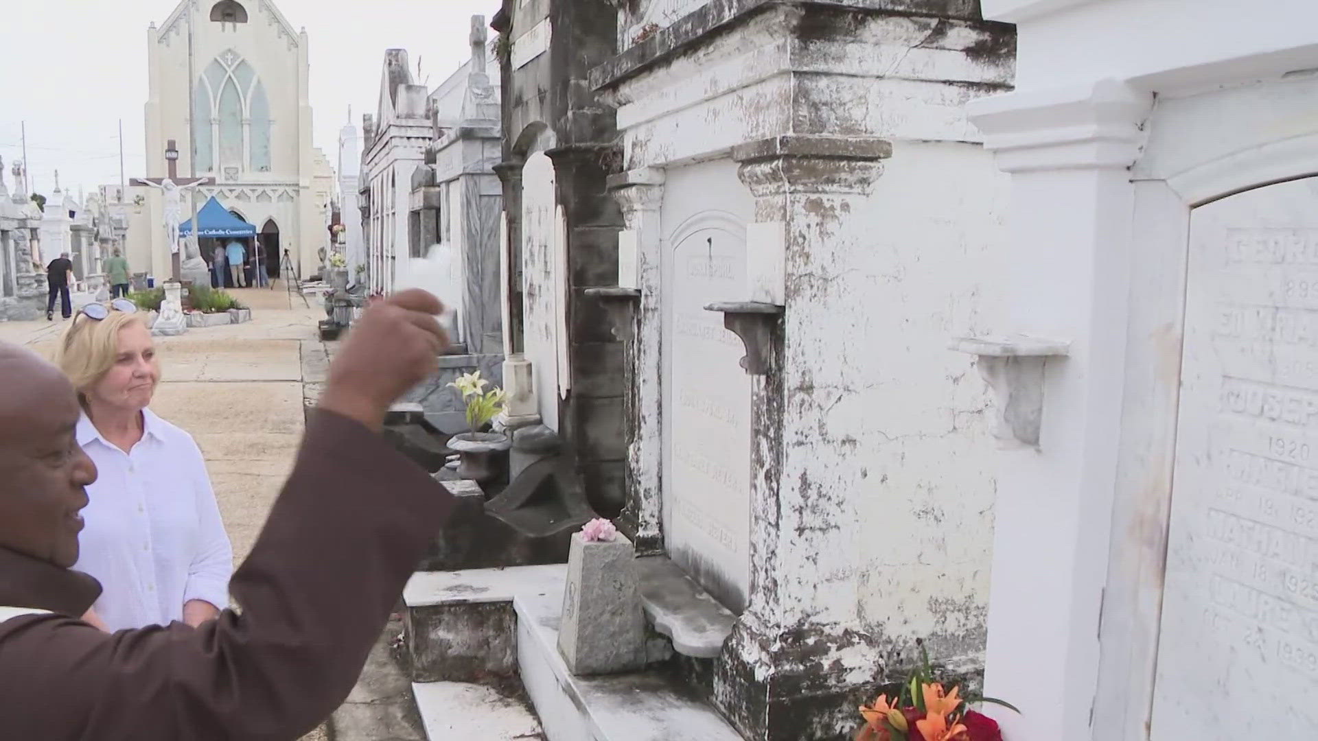 Local Catholics gathered to honor them and bless their graves at the St. Roch Cemetery.