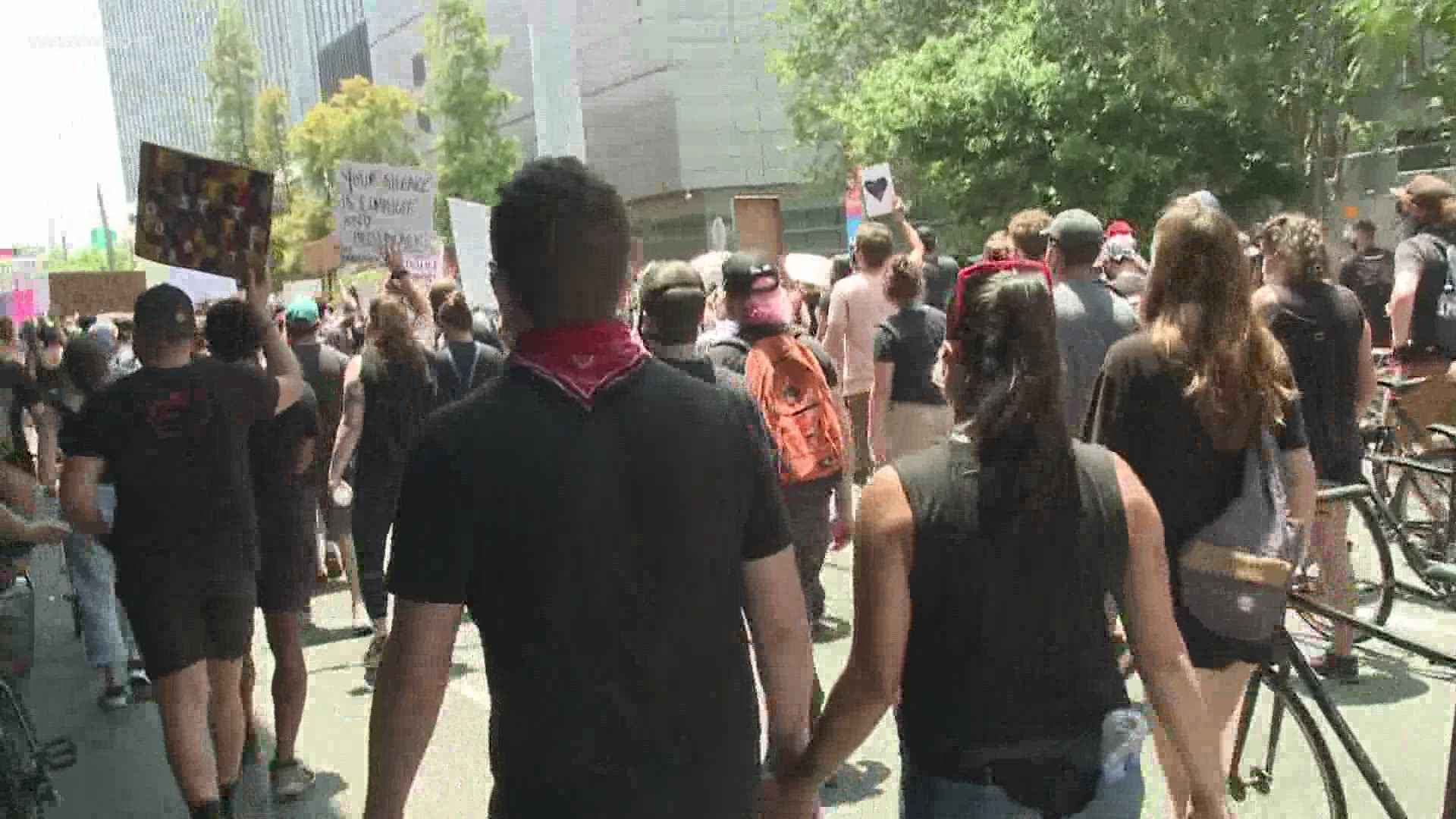 As they marched through parts of the city, they chanted "No Justice, No Peace," "Say his name. George Floyd" and "I Can't Breathe."