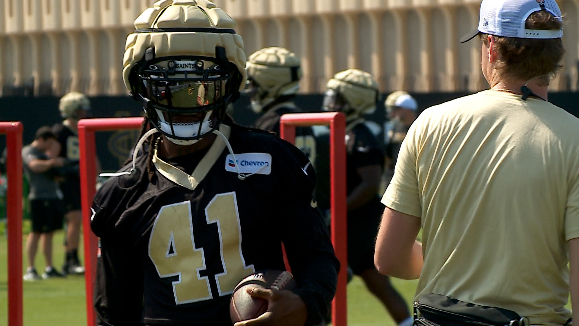 Alvin Kamara returns for the first day of the Saints 2024 training camp in California, while fellow running back Kendre Miller leaves early due to injury.