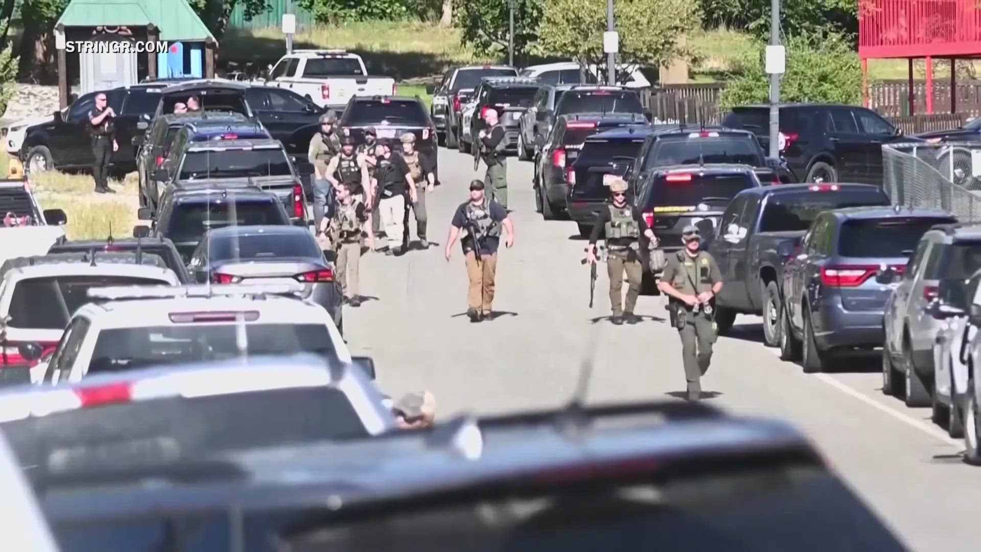 Officials say the suspect set the fire on purpose and then started shooting at the firefighters who arrived at the scene. 