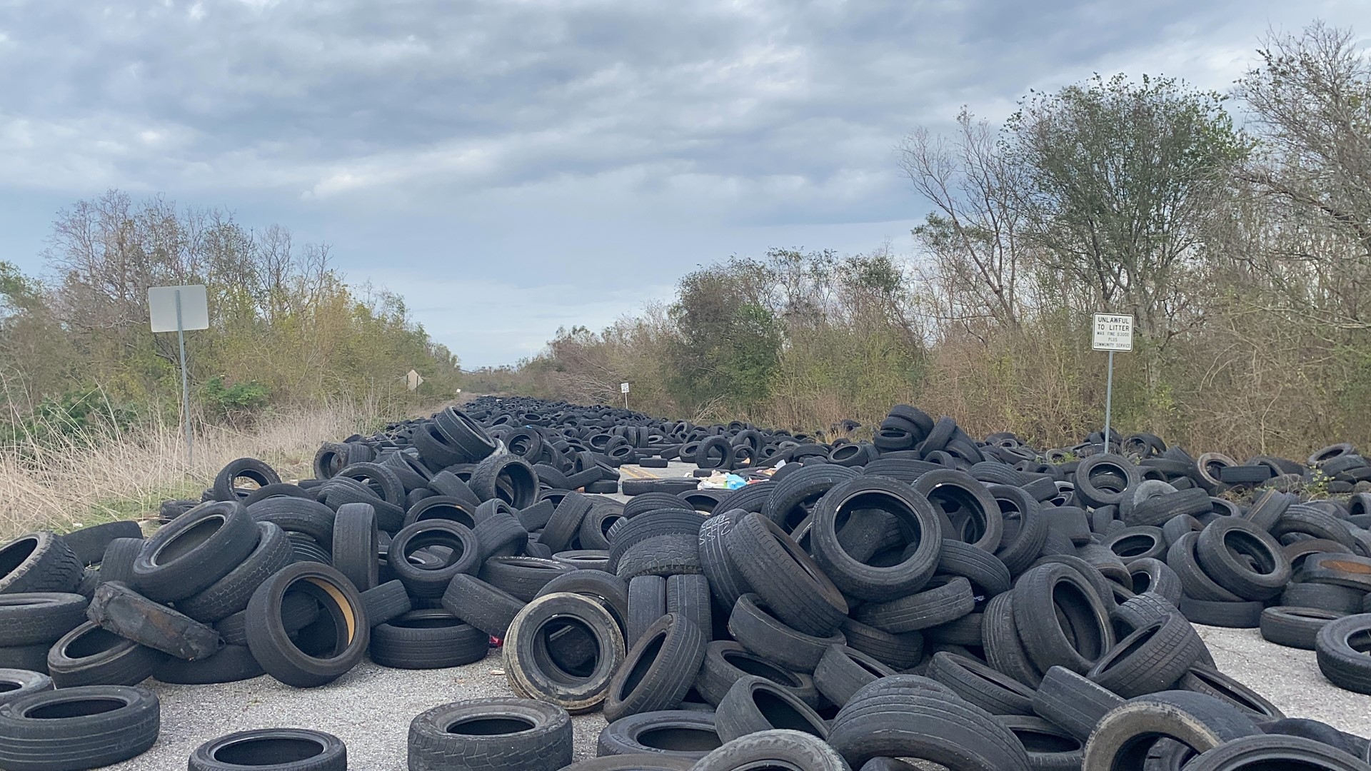 There are hundreds of tires left on the barricaded street behind the neighborhood that runs parallel to Interstate 510, between I-10 and Lake Forest Boulevard.