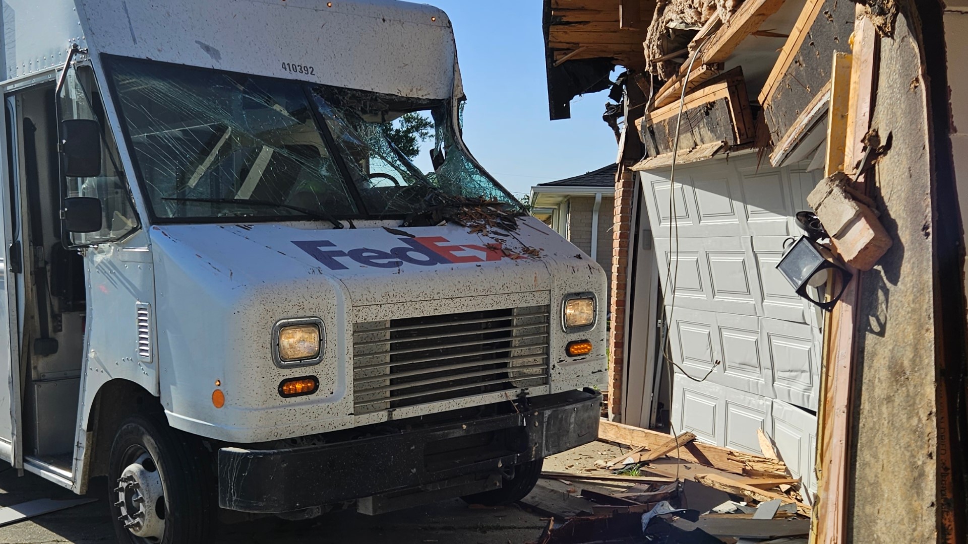 When police officers arrived, they found the delivery truck smashed through the front of the home, which was occupied at the time, but no one inside was injured.